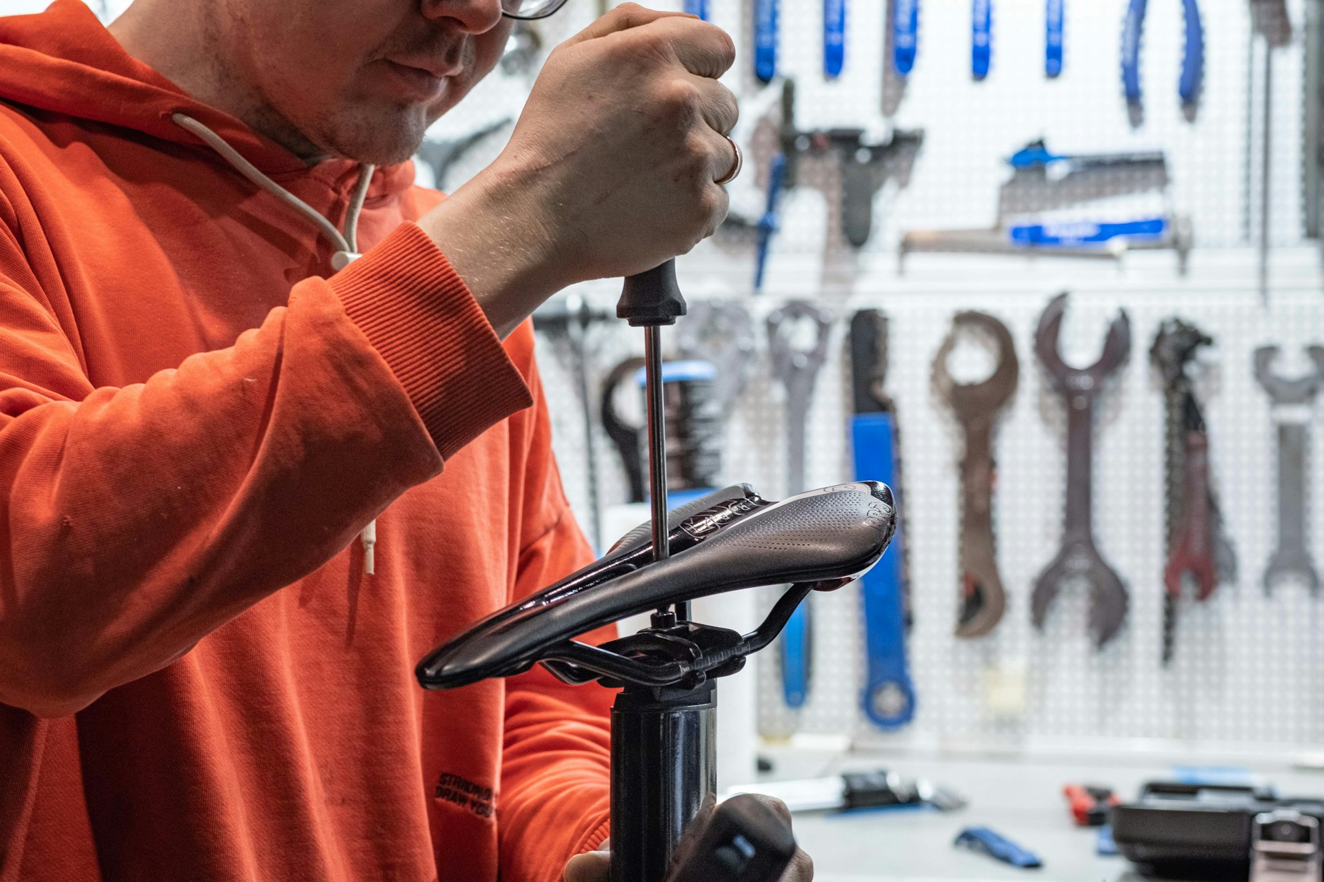 a man working on a bicycle in a shop